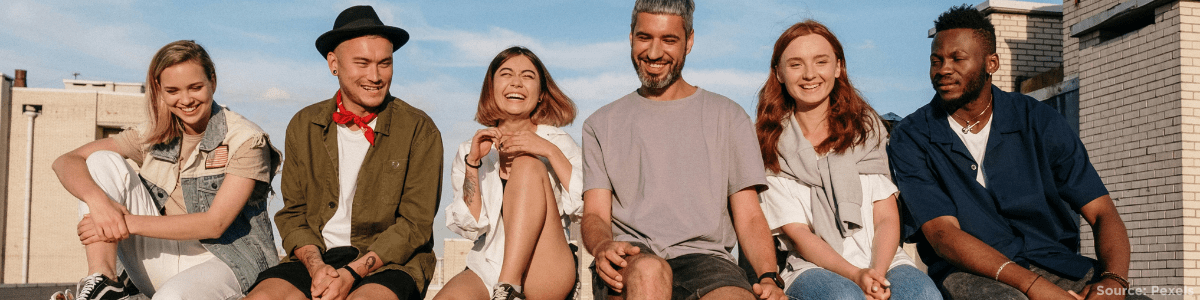 group of people sitting and smiling