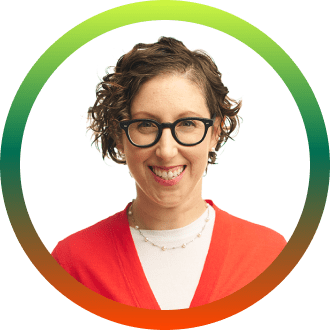 Headshot of a smiling woman wearing glasses