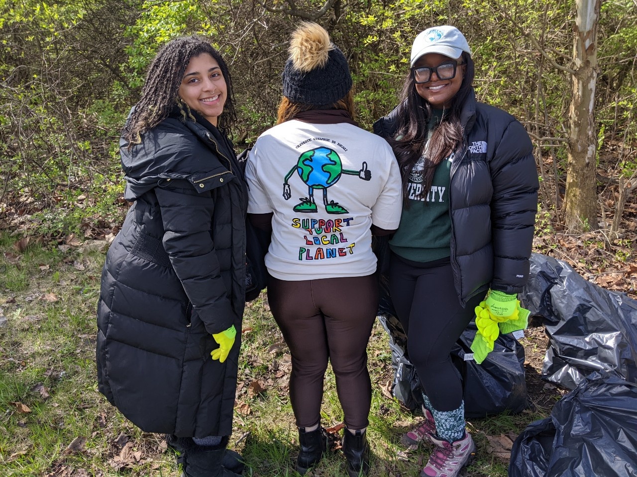 ECO Journey Detroit members show off their Earth Day tshirt