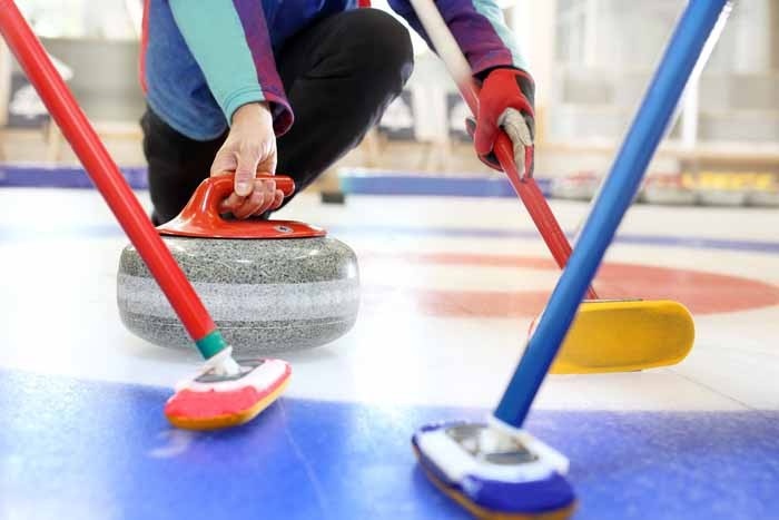 Men playing curling