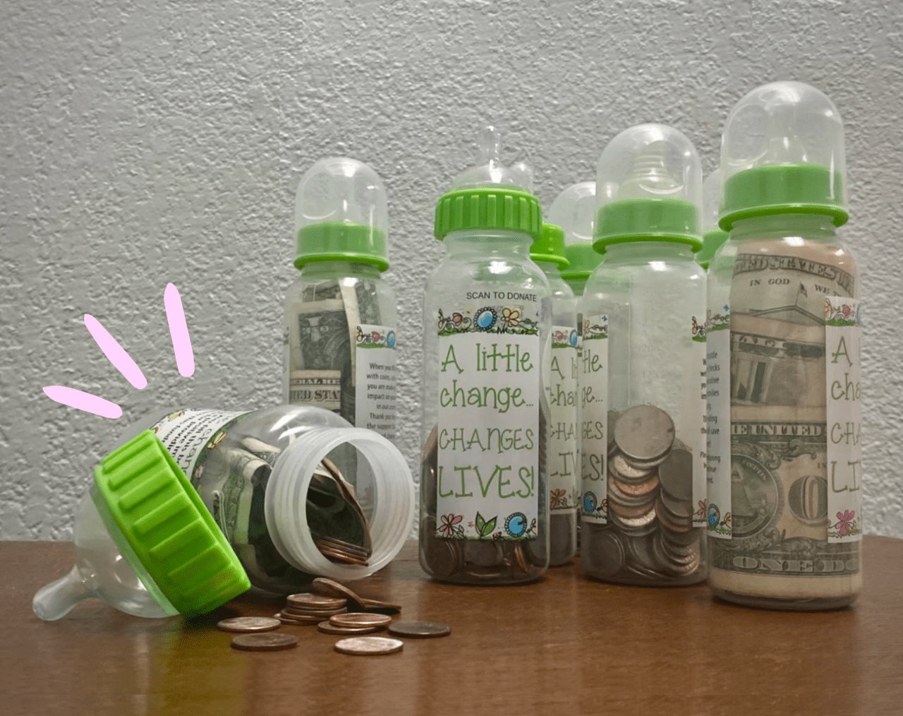 baby bottles from the fundraiser filled with cash and change