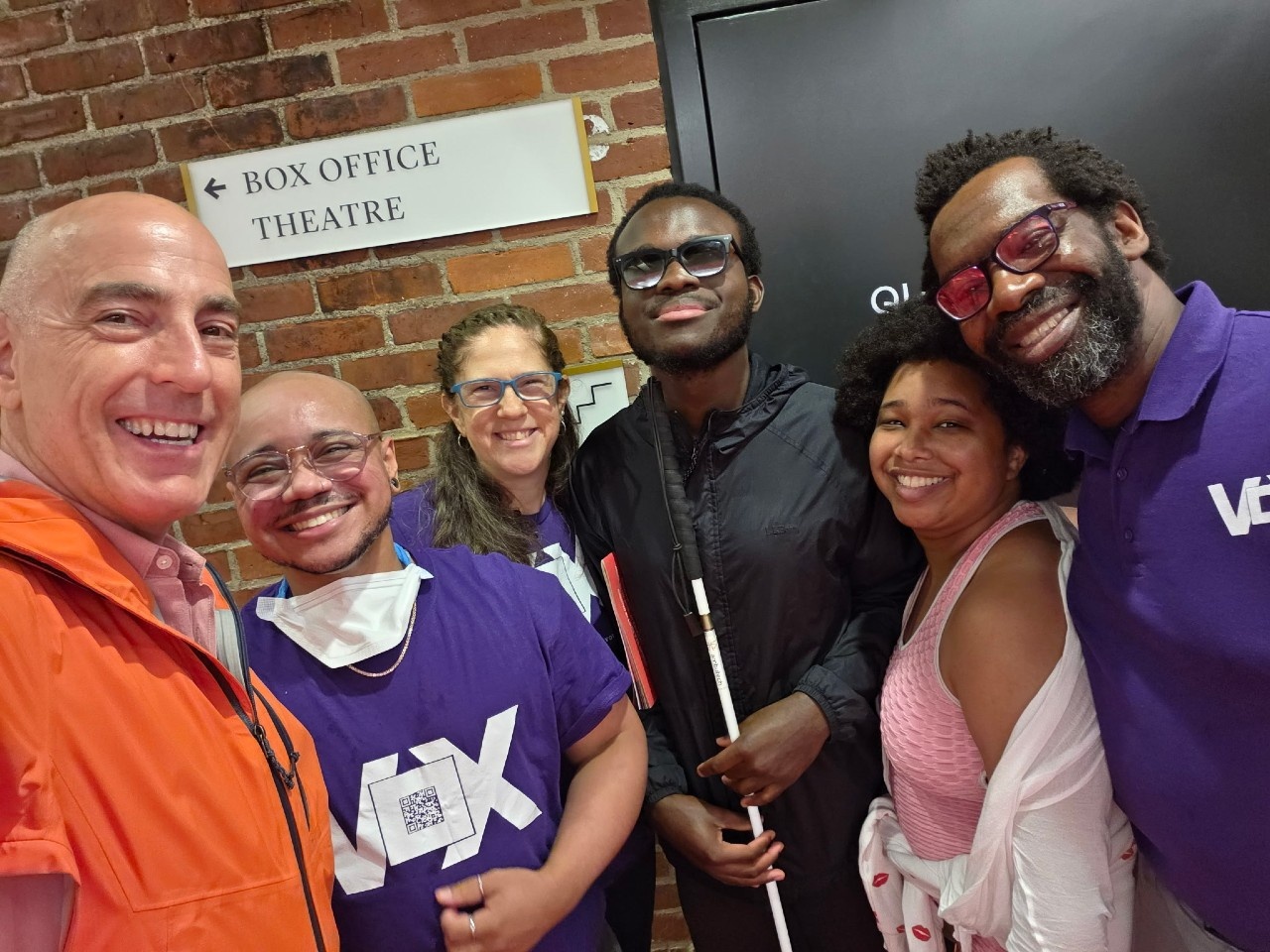 Voxers Christopher and Aimee with Audio Describer Eddie, Blind/Low Vision audience members Kwaku and Mikey, and resident Baritone and actor William Michals take a selfie.