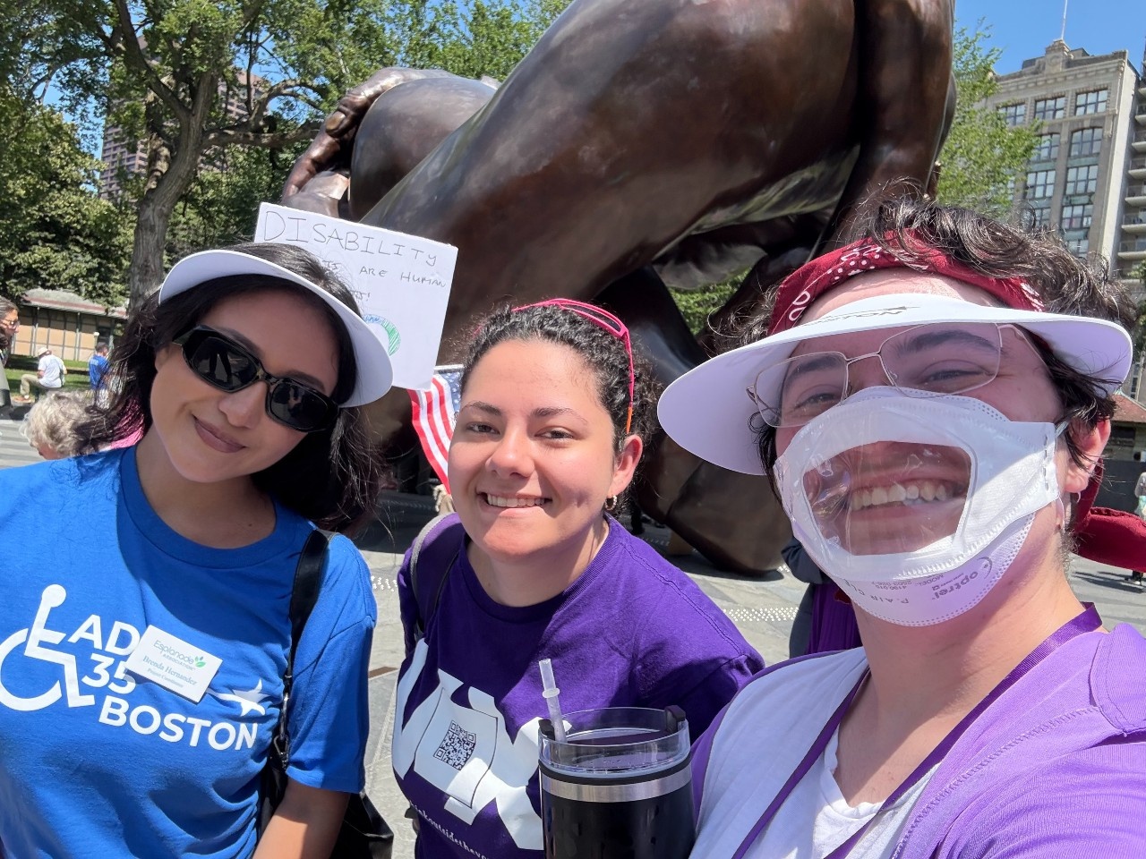 Voxers Via and Emit and friend from the Esplanade Brenda take a selfie at ADA 35 in front of Embrace Memorial.