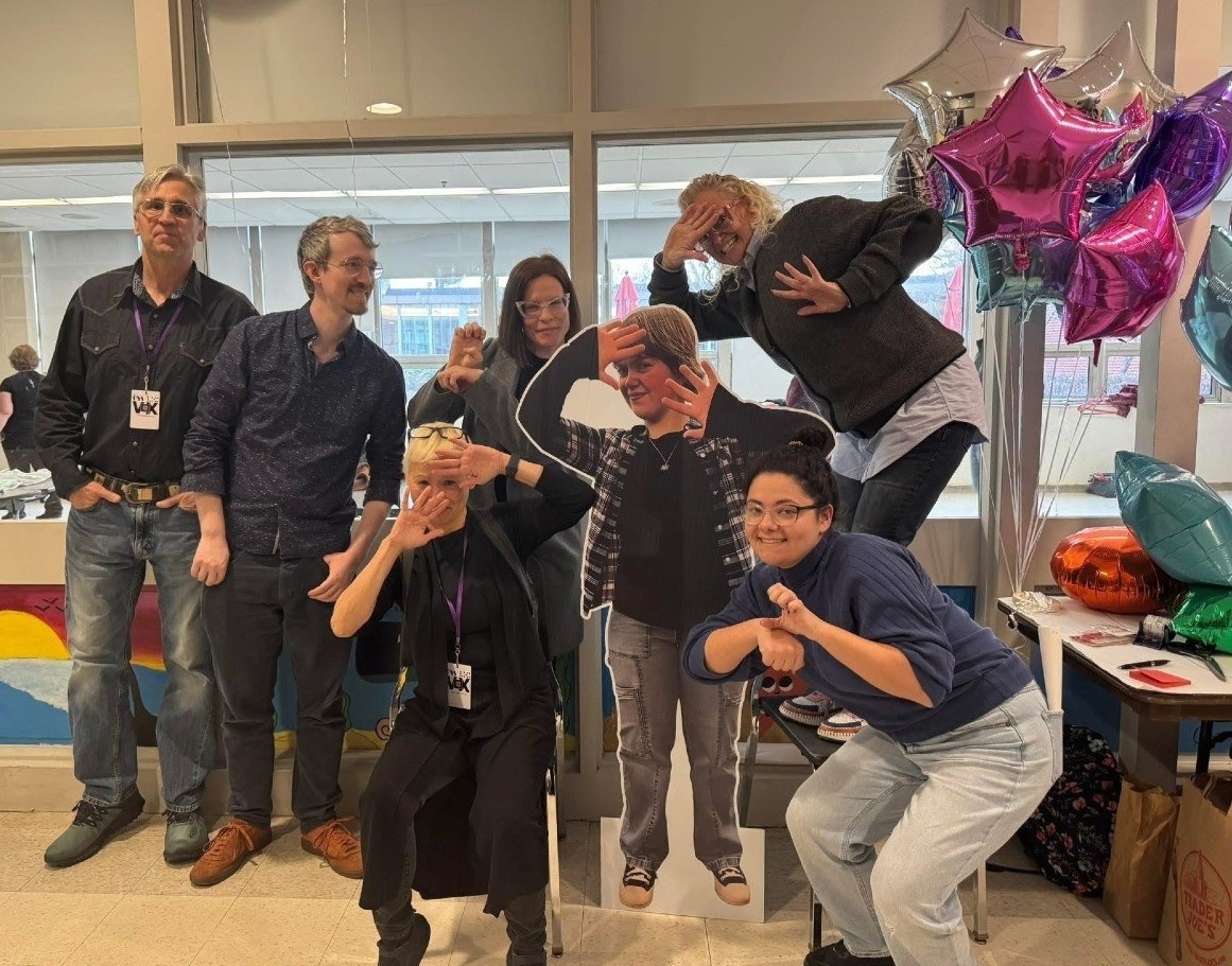 Vos DASL cohort members at Open Door Theater's The PROM posing with a cardboard cut out of Emma, the protagonist.