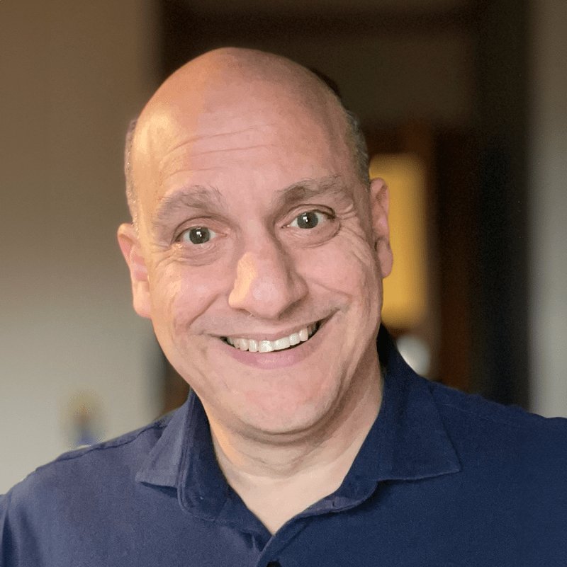 An image of Carlos Cuesta; when hovering the image changes to NEXT in Nonprofits podcast logo.