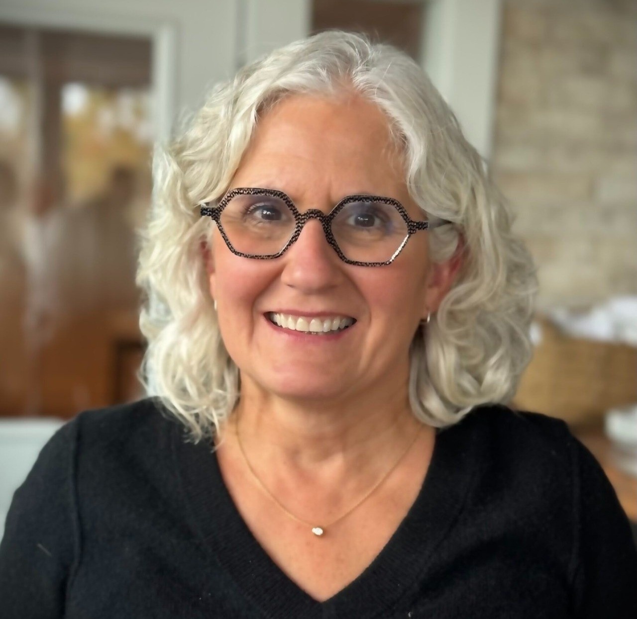 An image of Dr. Beth DaPonte; when hovering the image changes to NEXT in Nonprofits podcast logo.