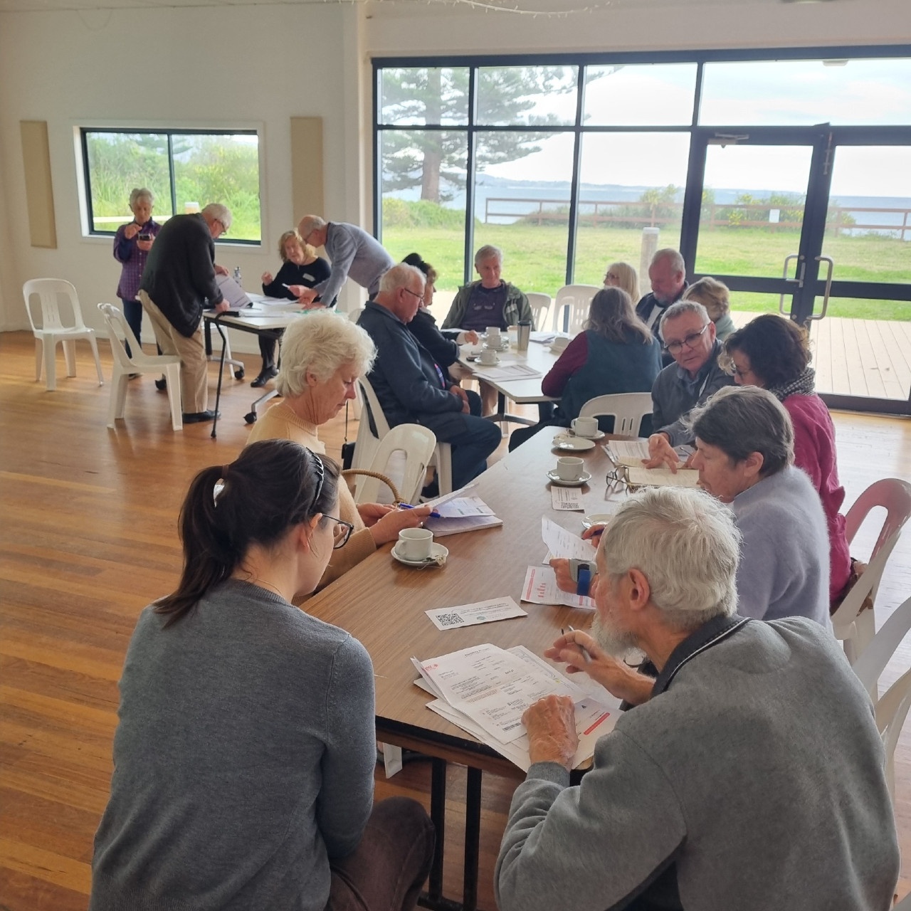 "Know Your Energy Bill" workshop attendees go through the details of their energy bills in the hands-on workshop, with help from Renewable Bermagui facilitators.