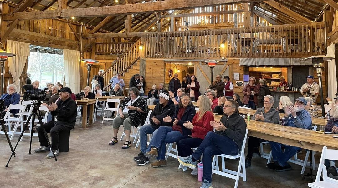 Crowd of people clapping at Concert for Democracy