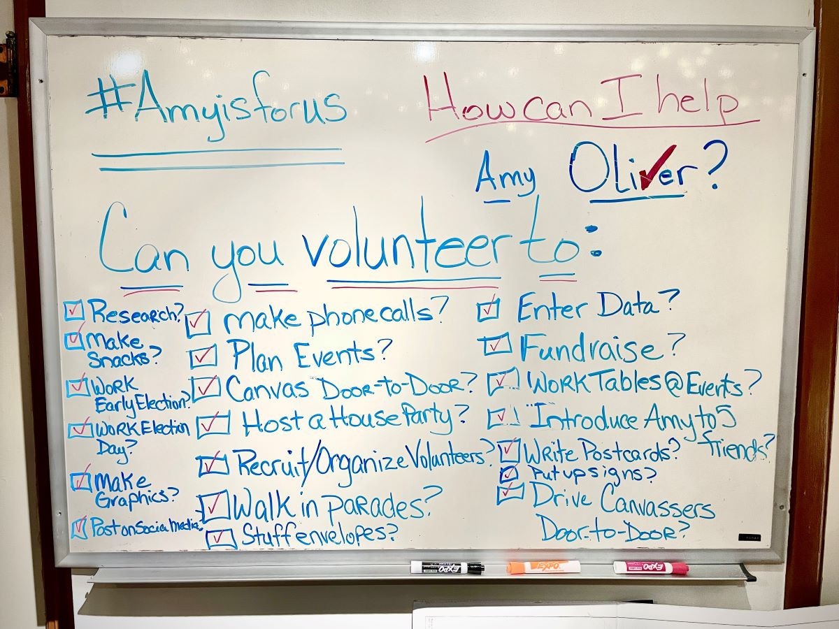 Whiteboard listing ways to volunteer with Amy