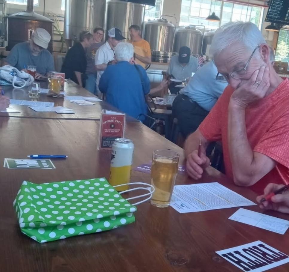 NCGA District 48 candidate Doyle Brown listening and sharing with Postcard Party attendees. Photo taken by Sheila Clendenning