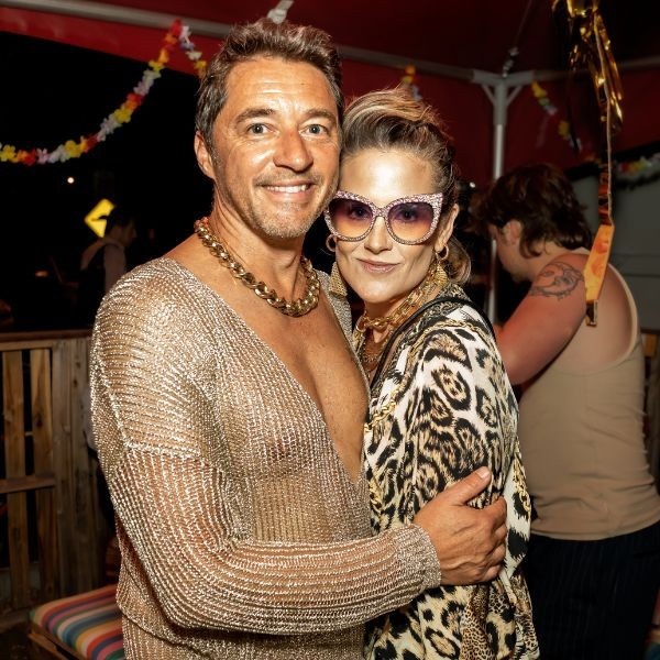 Mr Wright and Ms Martin at Littlefoot's 10th birthday party, dressed in gold.
