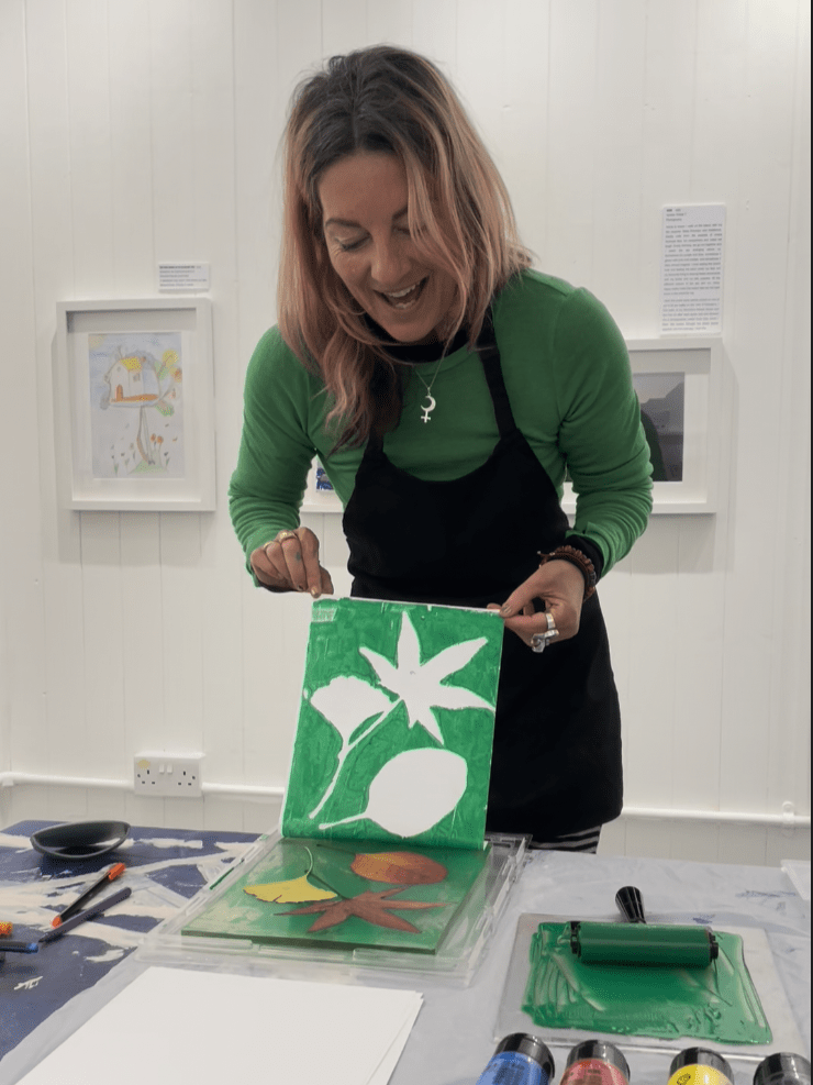Photograph of Fran, co-founder of the Space to Dream Gallery, doing some leaf printing.