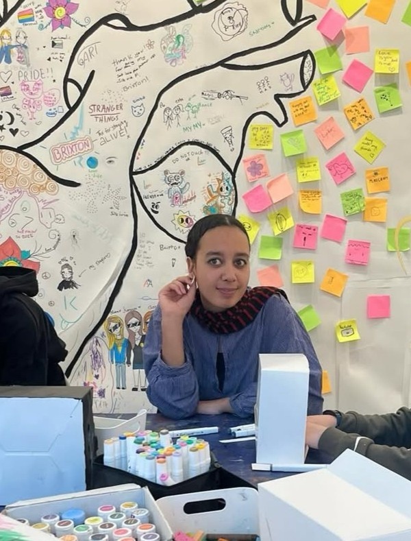 Picture of our new team member, Jalila, as she was participating in one of our art workshops.
