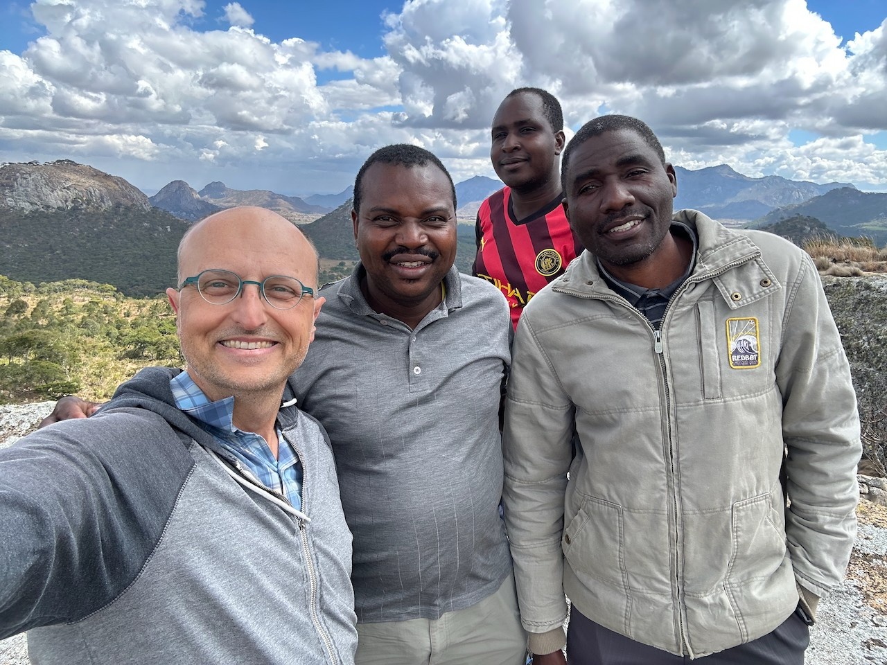 Me pictured with 3 local guides at the Chongoni Rock Art Site near Dedza, Malawi