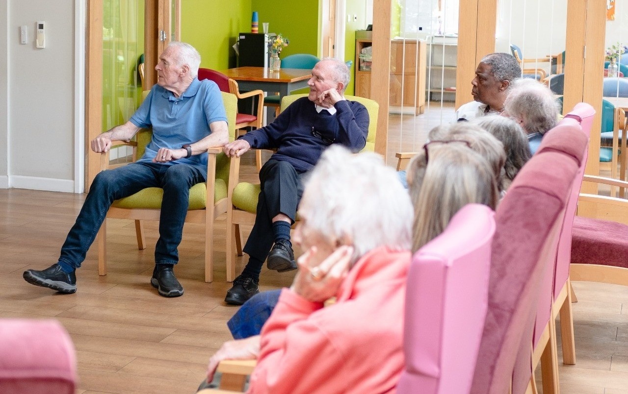 People dancing in Raleigh House, Staywell's flagship day centre in New Malden.