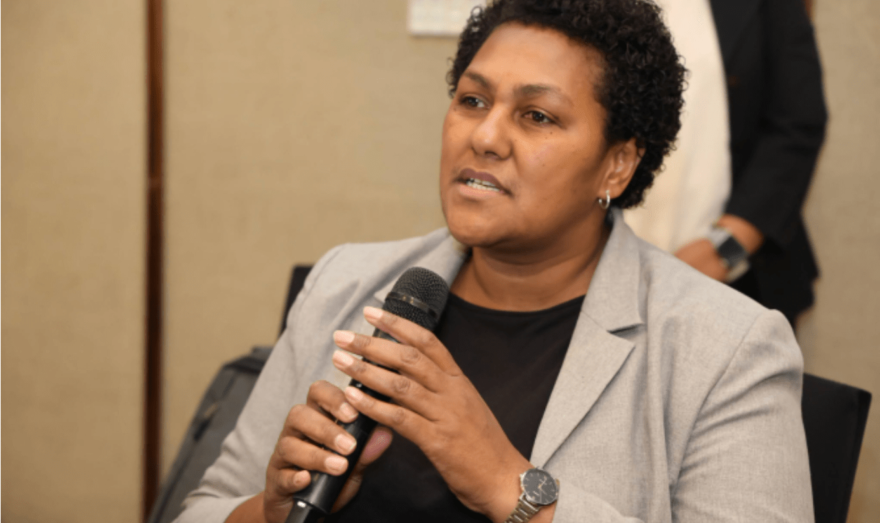 A woman with black hair holding a microphone, she is Ms. Senimili Baleicakau, Director of Environment, Fiji's Ministry of Environment and Climate Chan
