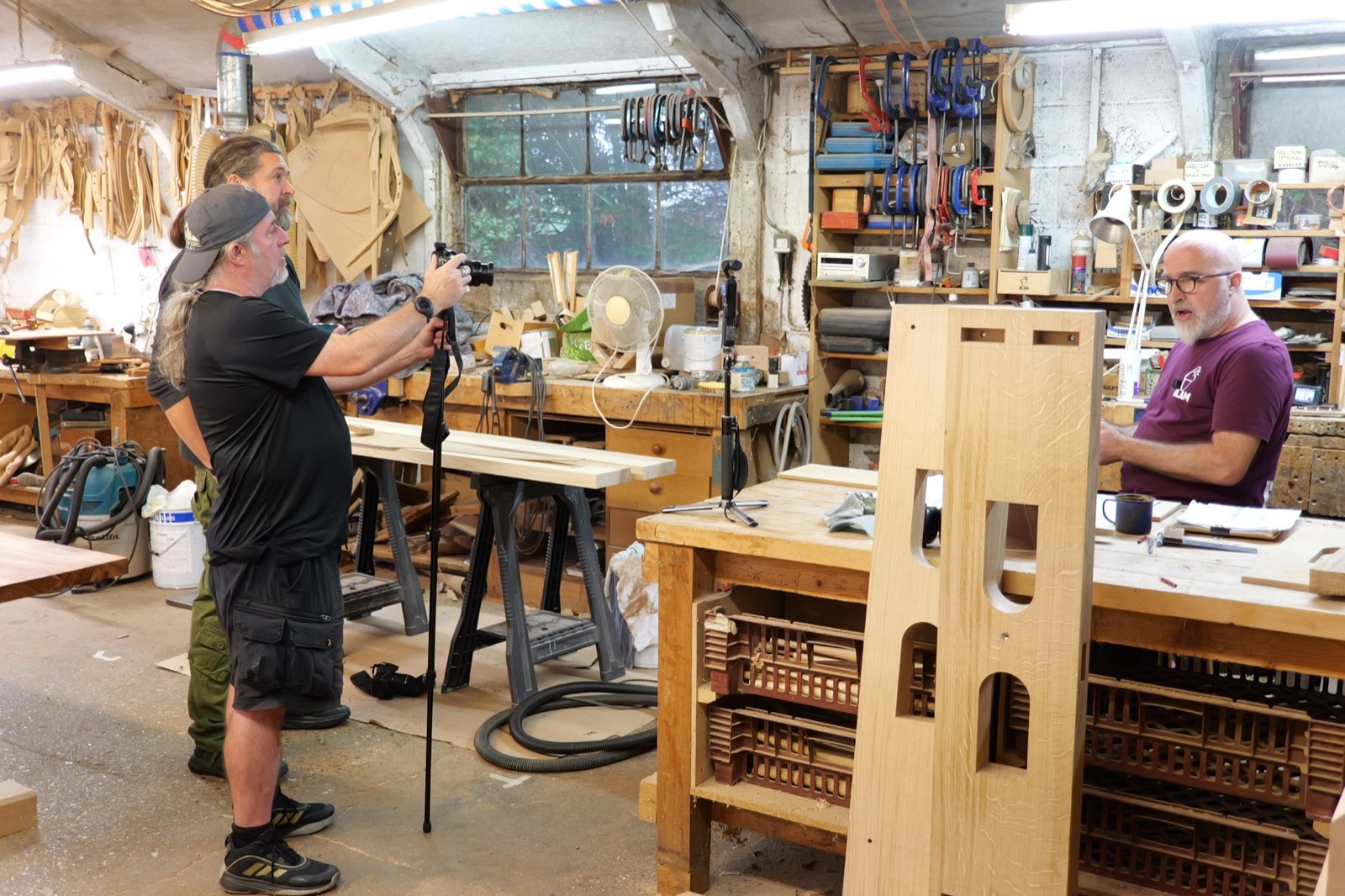 Josh Howard-Saunders with the oak printing press structure during filming on 20 October 2026.