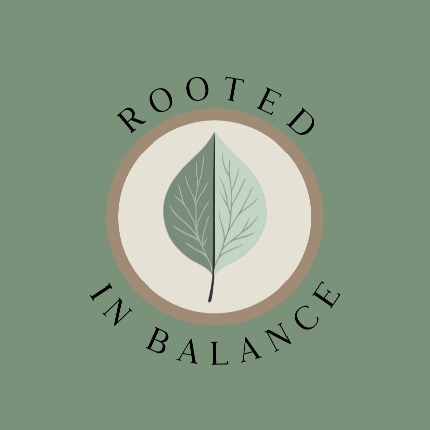 Rooted in Balance logo with a green leaf on a cream background in a circle.