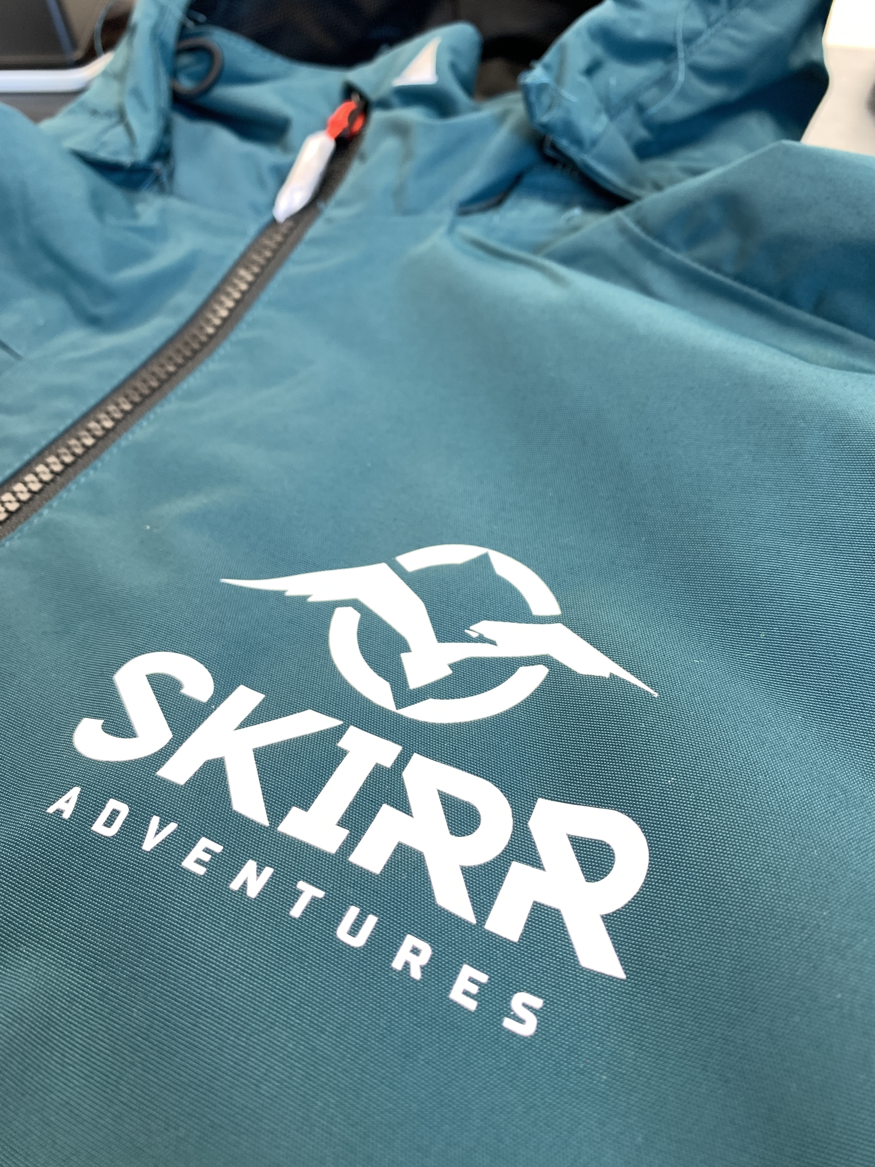 Teal jackets with SKIRR Adventures branding