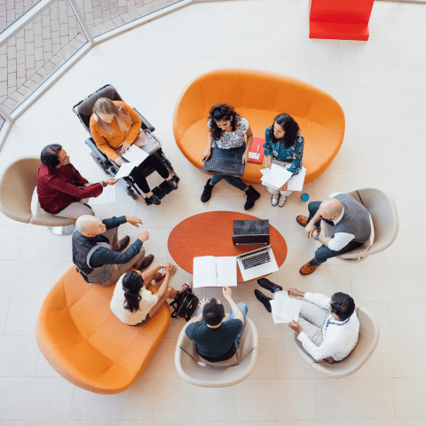 Pennies in a row and in a jar with a house o top.