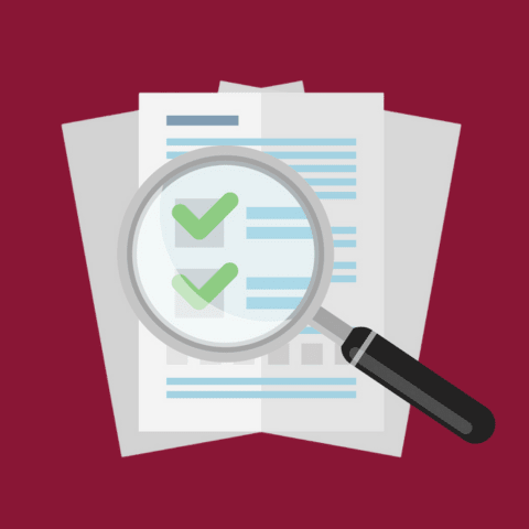 An image of a document with a magnifying glass focusing on the document.