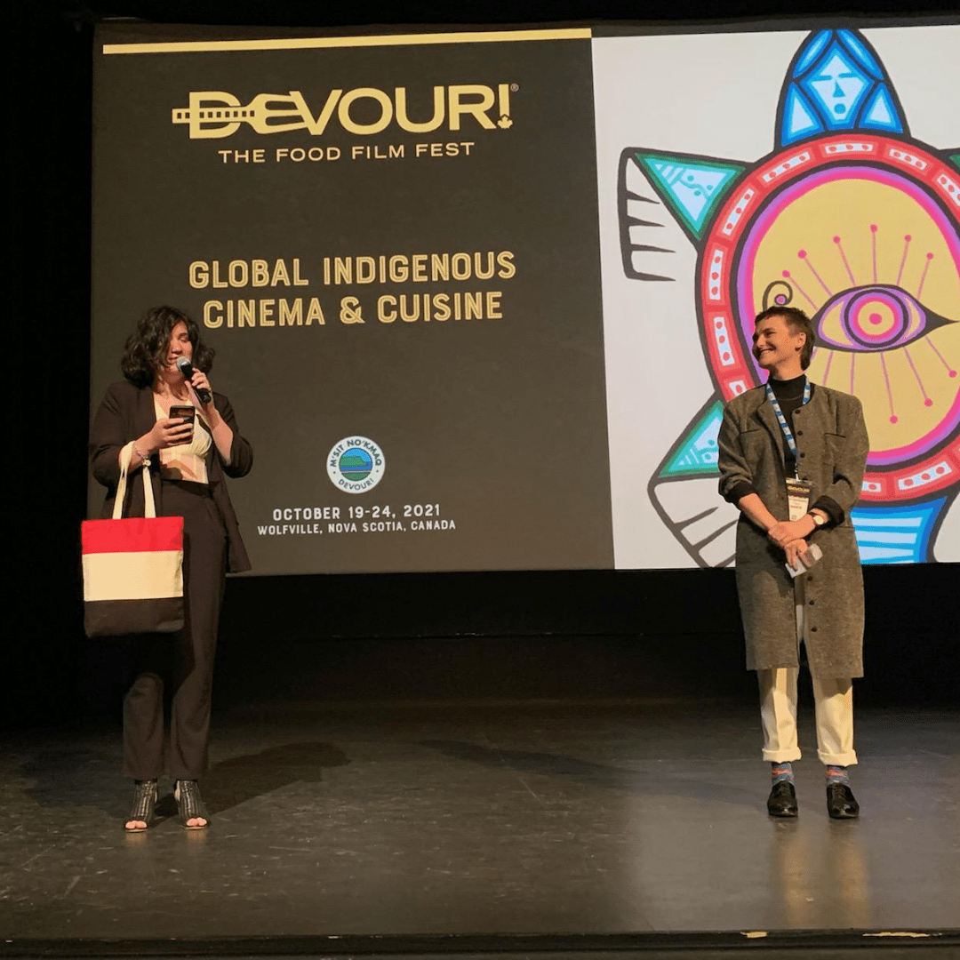 Nourish staff Nat presents the award to winner Morgan at Devour! The Food Film Fest